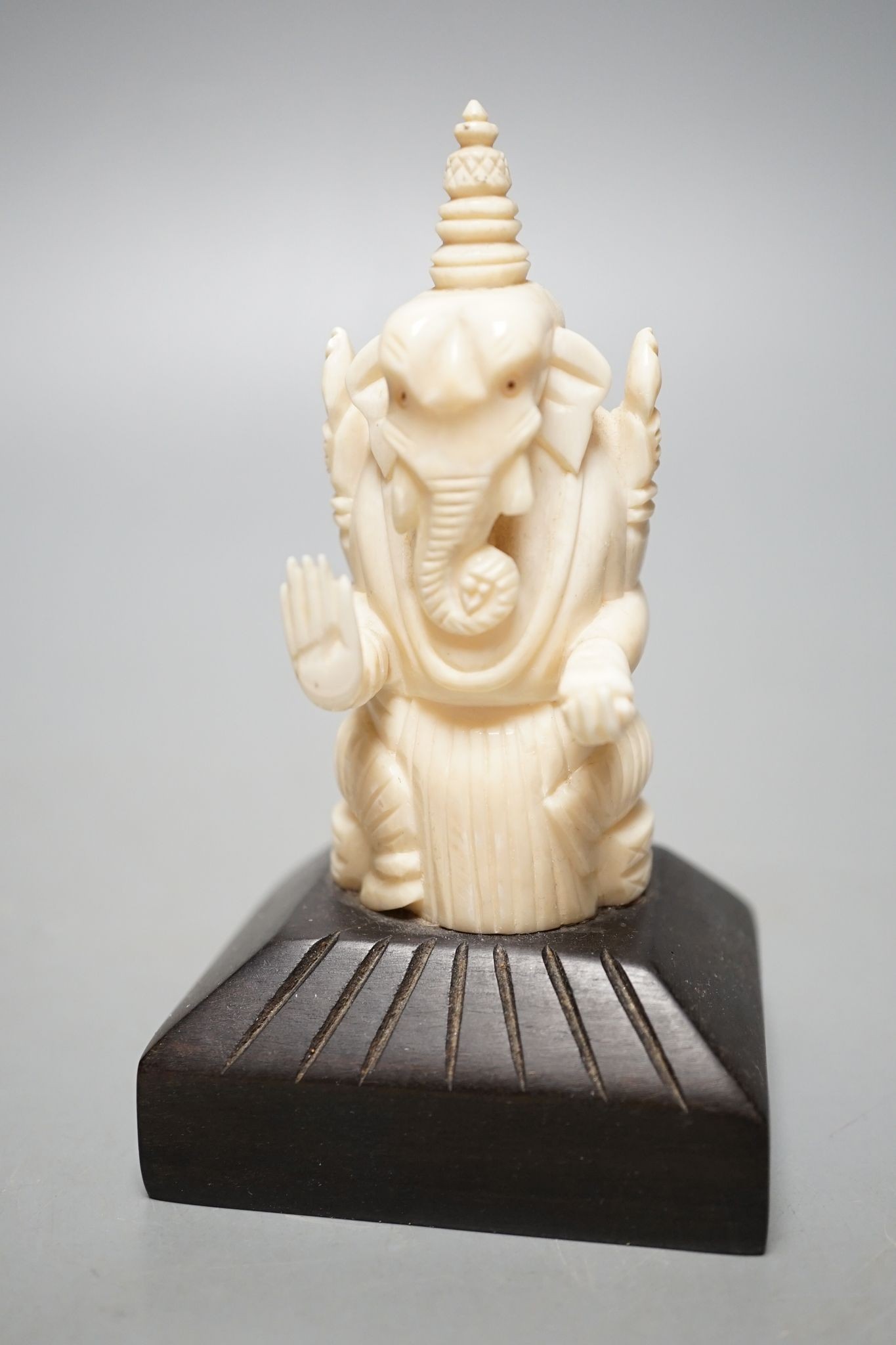 An Indian ivory letter opener, 38cm, and a Ganesh figure